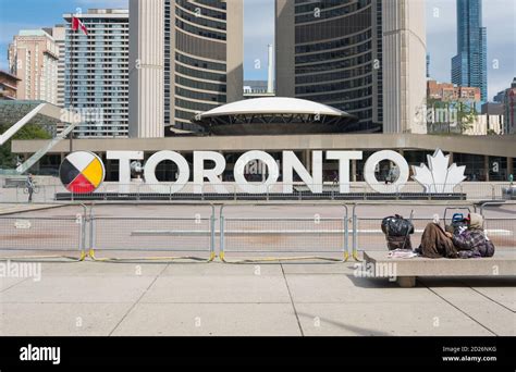 Rough sleeper in front of the 3D Toronto Sign, Nathan Phillips Square ...