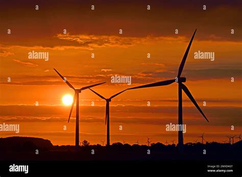 Wind Turbines In Front Of The Sunset Germany Hamburg Stock Photo Alamy