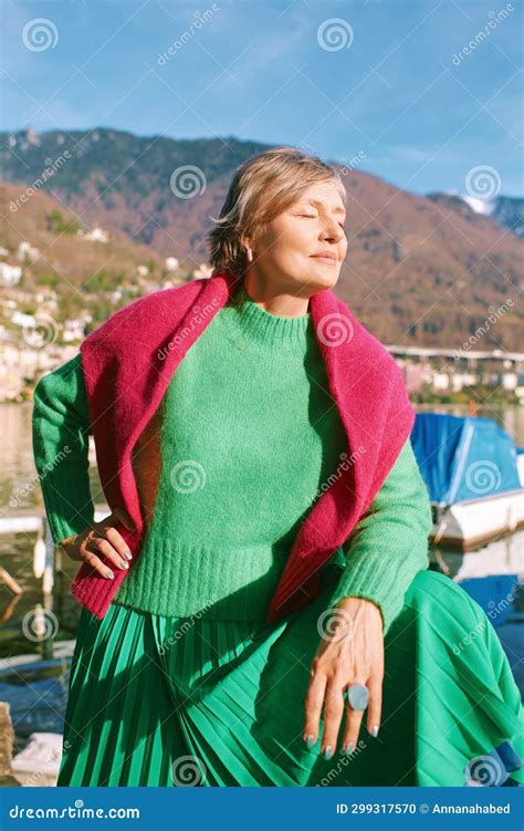 Outdoor Portrait Of Beautiful Mature Woman With Grey Hair Stock Photo