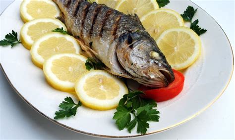 Grill Cooked Fish With Lemon Slices Stock Photography - Image: 20281452