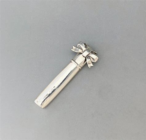 A Delightful Edwardian Silver Buttonhole Lapel Flower Holder