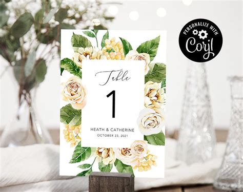 A Table Number Card With Flowers On It