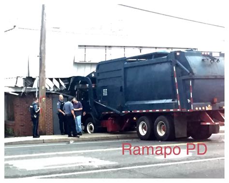 Garbage Truck Crashes into Vehicle Then Building (Photos)