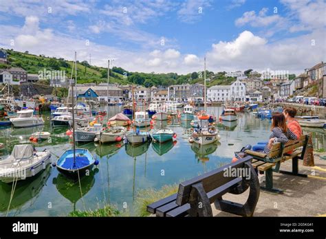 Visitors enjoying Mevagissey in Cornwall Stock Photo - Alamy