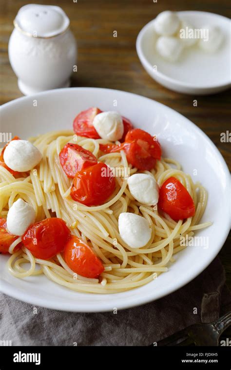 pasta with roasted tomatoes, food Stock Photo - Alamy