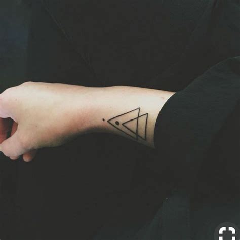 Double triangle and dots tattoo on the right wrist | Geometric tattoo ...