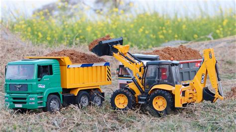 Jcb Cx Backhoe Loading Mud In Tata Truck And Tata Tipper Truck