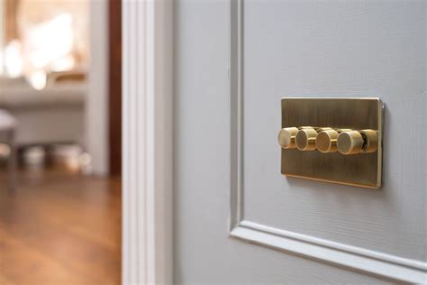 This Luxury 24k Brushed Brass 4 Gang 2 Way Intelligent Trailing Dimmer Switch With Black Insert