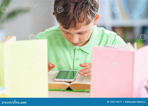 Lazy Kid Enthusiastically Plays Game on Smartphone instead Homework ...