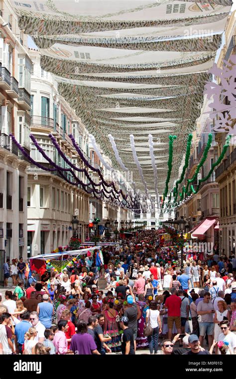 Crowds of people at the Malaga Fair, Feria de Málaga Day in Malaga ...