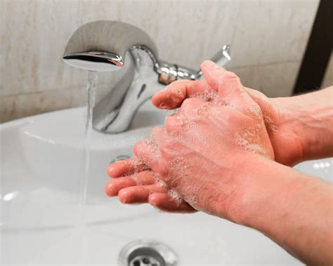 Man Washing Hands With Water And Soap In Bathroom Stock Photo Image