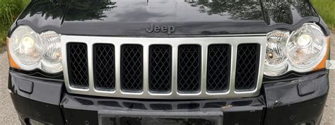 JEEP GRAND CHEROKEE WK LIFT LAMPY KSENON ORYGINAŁ LAMPY XENON KSENONOWE