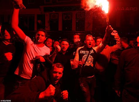 Shirtless Ajax Fan Climbs Scaffolding To Lead Chants In Central London