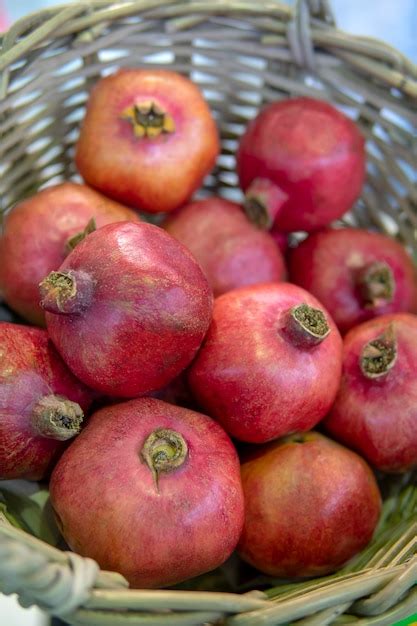 Premium Photo Red Ripe Pomegranates In The Basket