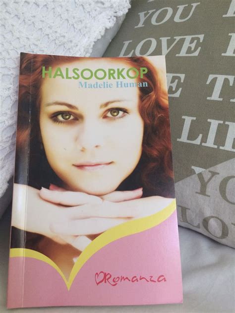 A Book Is Laying On Top Of A Bed