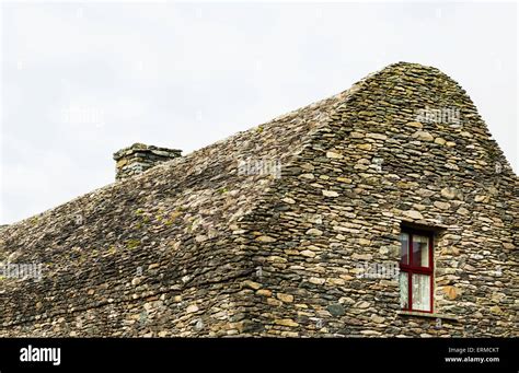 All Stone Building Bee Hive Structure With Small Red Framed Window