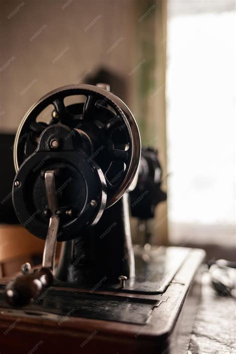 Premium Photo An Old Sewing Machine Stands On The Table At Home Ready