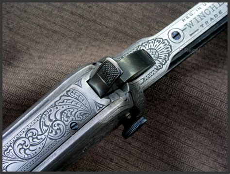 hand engraved winchester model   short pump action rifle