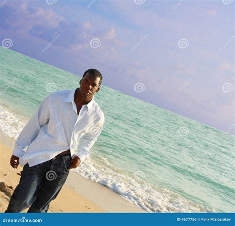 Man Walking On The Beach Royalty Free Stock Image - Image: 4677756