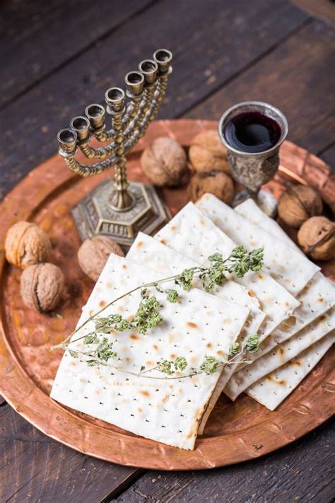 Passover The Feast Of Unleavened Bread Matzah Bread And Red Wine Glasses On The Shinny Round