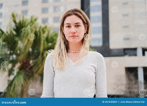 Close Up Portrait of Blonde Caucasian Young Woman Looking Serious at ...