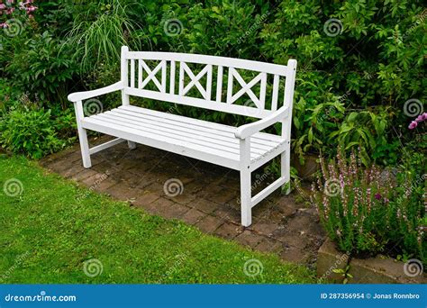 Wooden Park Bench Painted White Standing in Green Garden Stock Photo ...