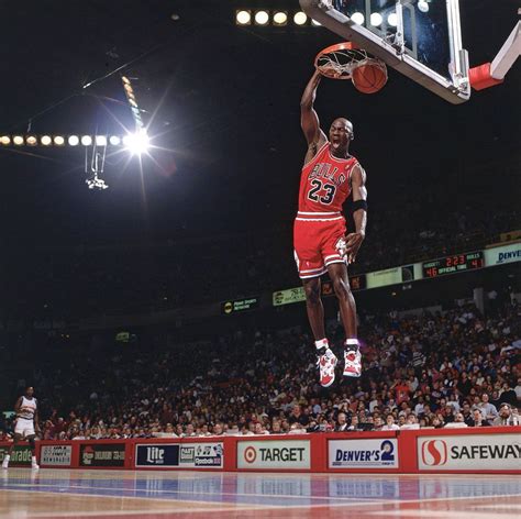 Michael Jordan finishes off a fast break with an emphatic slam dunk ...