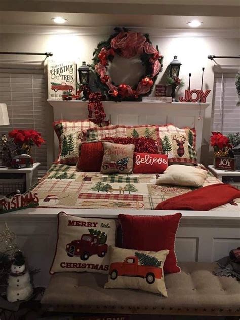 A Bedroom Decorated For Christmas With Red And Green Decorations On The Bed Wreaths And Pillows