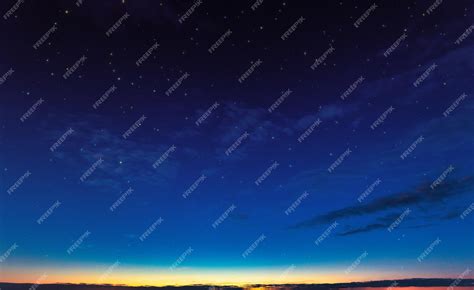 Premium Photo | Evening sky day turns to night Sunset clouds and starry sky