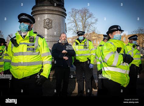 A Protester Is Arrested And Handcuffed By Police On Clapham High Street