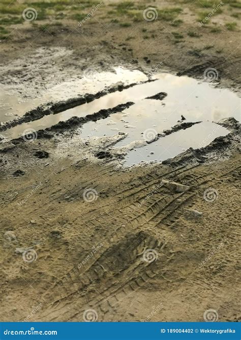 Puddles In Rainy Day Muddy Field Dirt Road After Rain Puddle And Mud