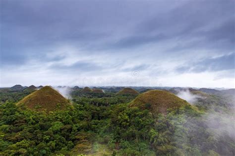 The Famous Chocolate Hills at Sunrise on a Cloudy Day with Mist ...