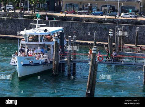 Passengers boarding a ferry in Stresa Stock Photo - Alamy