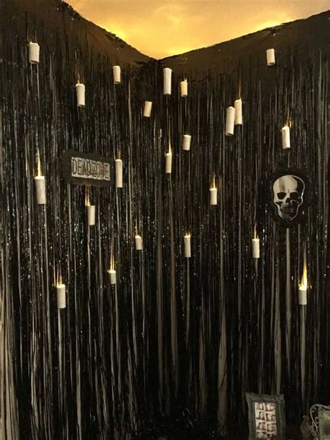 The Wall Is Decorated With Candles And Skulls On Its Sides Along With