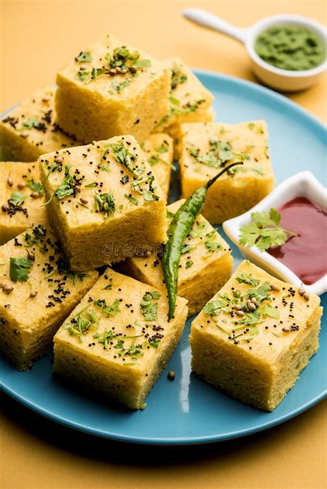 Gujarati Khaman Dhokla Or Steamed Gram Flour Puffy Snack Cake Stock