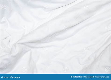 Top View Of A Messy Bedding Sheet After Night Sleep White Fabric Crease