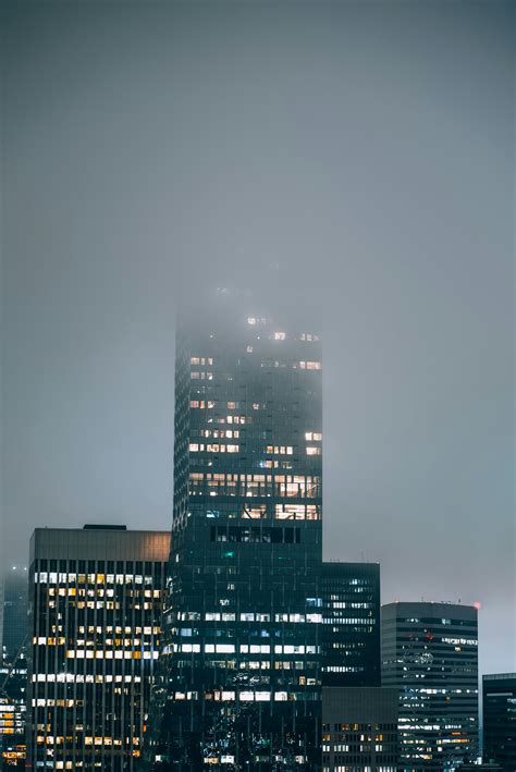 High-rise Building Beside Buildings during Night · Free Stock Photo