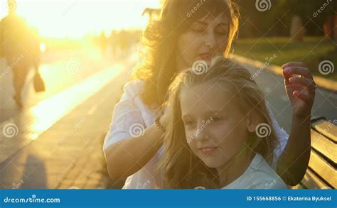 Beautiful Young Mother And Her Daughter Have Fun In The Park Mother