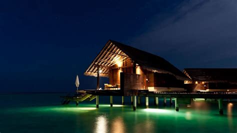 Download Wallpaper 1366x768 Maldives Tropical Bungalows Night Tablet