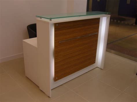 White Laminate Reception Counter With Glass Top And Wood Laminate Front