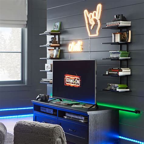 A Television Sitting On Top Of A Blue Entertainment Center