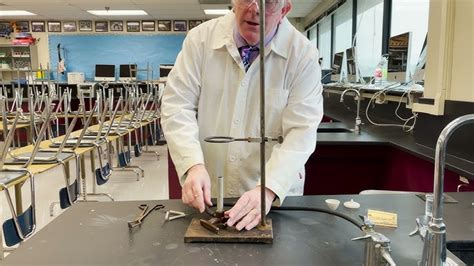 Ring Stand With Bunsen Burner And Evaporating Dish