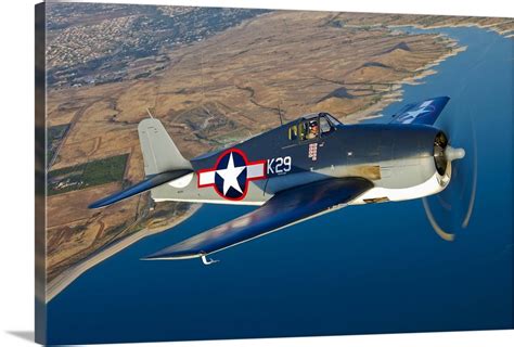 A Grumman F6f Hellcat Fighter Plane In Flight Wall Art Canvas Prints