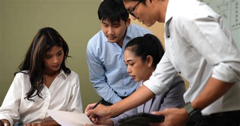 Handheld medium shot, Selective focus, Asian Young female workers