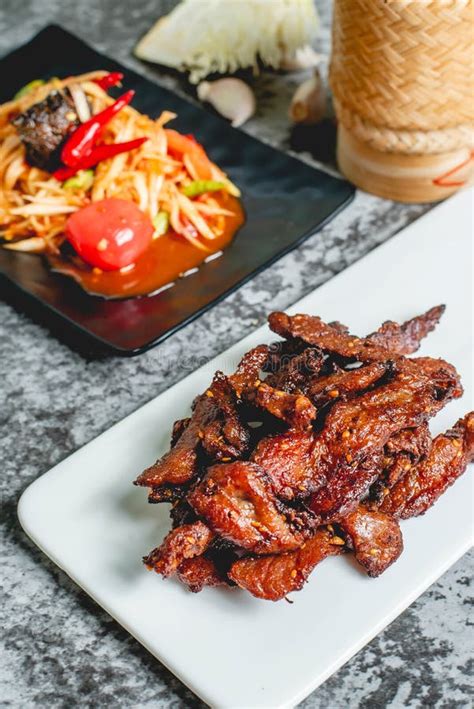 Deep Fried Sun Dried Pork Moo Dad Deaw With Papaya Salad Som Tum