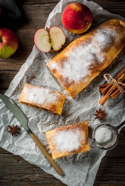 Premium Photo | Apple strudel with nuts, raisins, cinnamon and powdered sugar