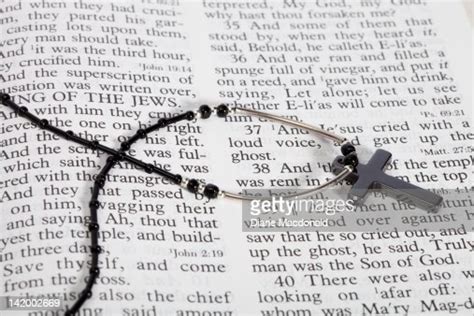 Cross Necklace On An Open Bible High-Res Stock Photo - Getty Images