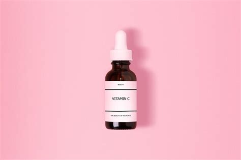 Premium Photo White Bottle Of Vitamin C Serum Resting On A Pastel