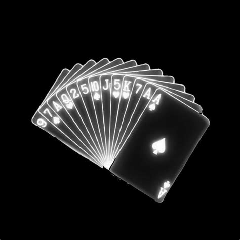 Six Playing Cards Are Lit Up In The Dark With White Letters On Them