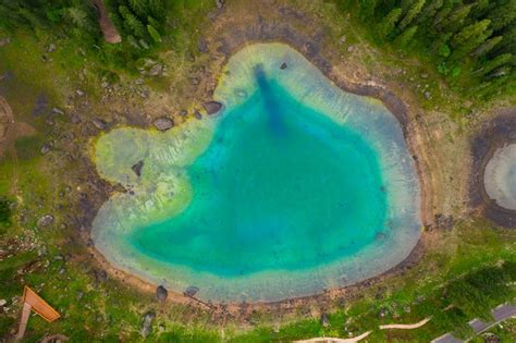 Premium Photo Aerial View Of Turquoise Blue Water Of Lake Carezza In